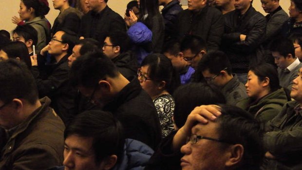 Chinese relatives of passengers attend a conference with Malaysia Airlines.