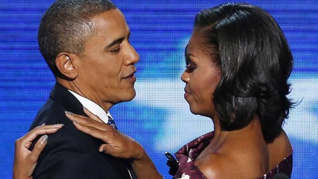 Barack Obama hugs his wife before addressing the convention.