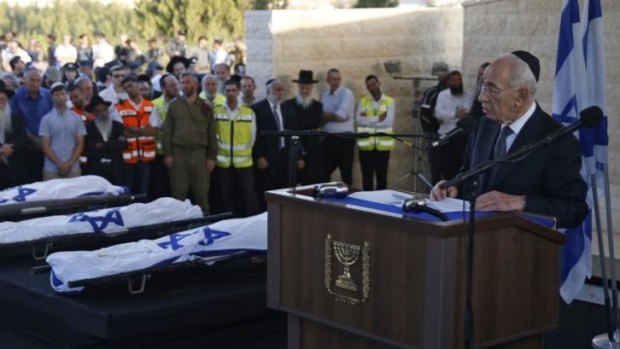 Israeli President Shimon Peres speaks at the funeral of Gilad Shaer, Naftali Frenkel and Eyal Ifrach on Tuesday.