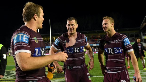 Old school: Brenton Lawrence, centre, enjoys victory over the Panthers with Jake Trbojevic and Daly Cherry-Evans.