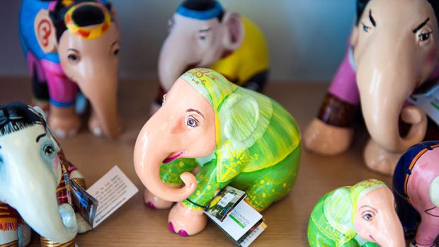 Colour Factory sells brightly painted elephant figurines.