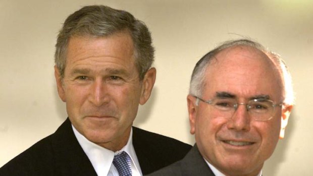 Then United States president George W.  Bush and then Australian prime minister John Howard walk together from the Oval Office of the White House following a meeting on September 10, 2001.