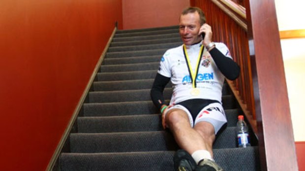 Call waiting ... Abbott on his Blackberry during Pollie Pedal in April.