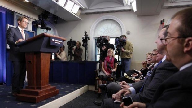 What's wrong with this picture? White House spokesman Jay Carney fronts the media during the daily briefing at the White House. 
