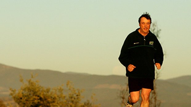 Taking off: Mick Keelty on his morning run.