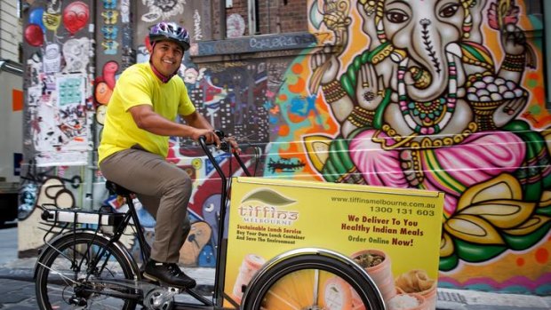 Food to go: Kedar Pednekar operates a pedal-powered lunchtime curry delivery service