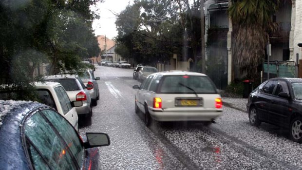 Potentially damaging hailstones litter Sydney's streets following a hailstorm.
