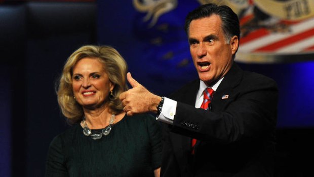 US Republican Presidential candidate Mitt Romney and his wife Ann greet supporters at the end of the third and final presidential debate.