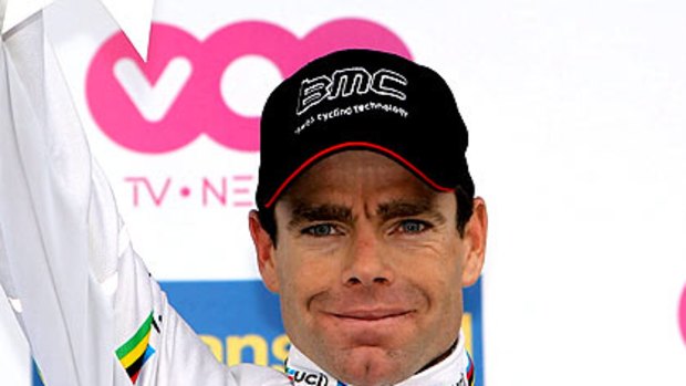 Cadel Evans celebrates on the podium after winning the Fleche Wallonne one-day classic.