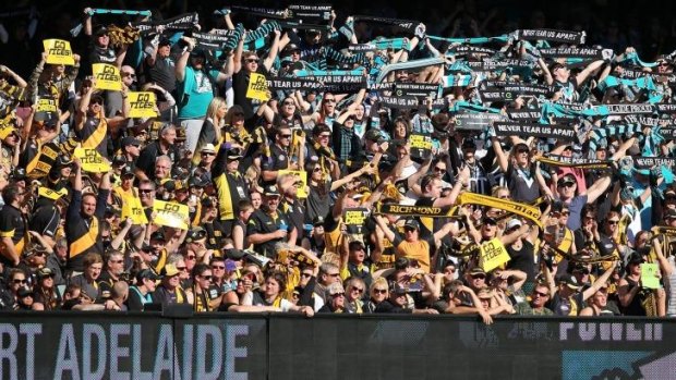 Supporters of Richmond and Port Adelaide enjoy the atmosphere at the elimination final on Sunday.