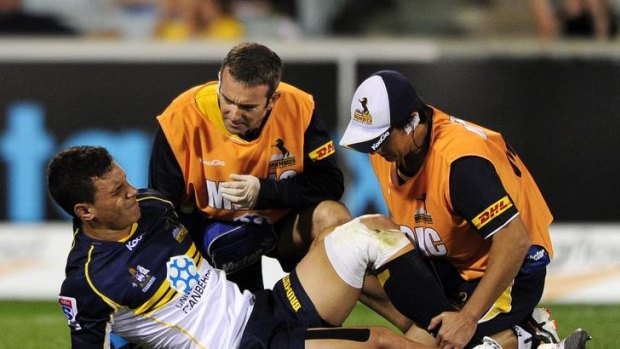 Matt Toomua in distress after rupturing his ACL against the Sharks on Saturday night.