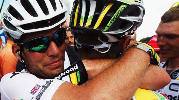 Mark Cavendish of Great Britain and HTC Highroad celebrates with teammates after winning stage seven.