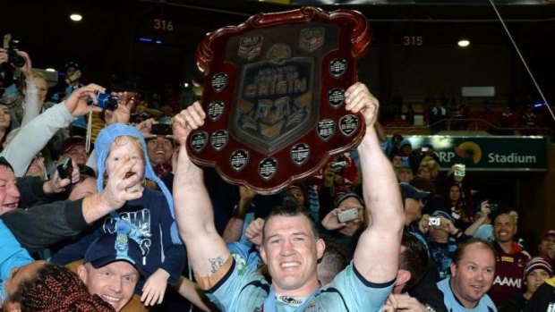 Proud moment: Paul Gallen lifts the State of Origin shield.