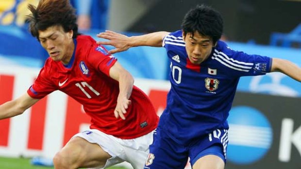 Out . . . Shinji Kagawa will miss the Asian Cup final against Australia.