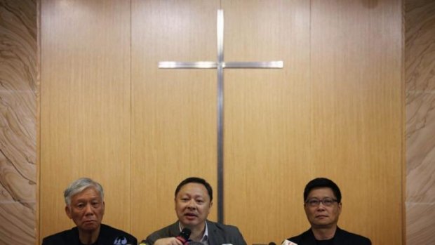 Founders of the Occupy Central protest movement (from left) Reverend Chu Yiu-ming, Benny Tai and Chan Kin-man hold a news conference after an unofficial poll in which almost 800,000 votes were cast.