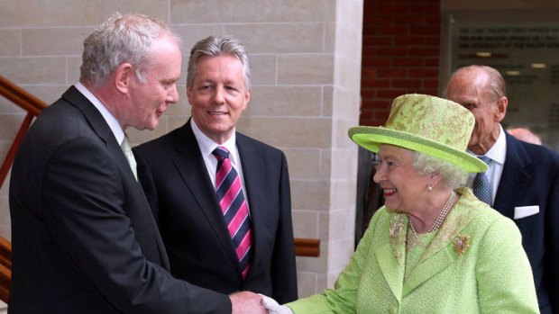 Historic ... the Queen shakes hands with Martin McGuinness.