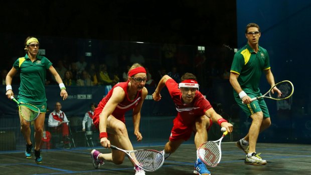 David Palmer and Rachael Grinham on their way to claiming gold for Australia in the mixed squash doubles against English duo Peter Barker and Alison Waters.