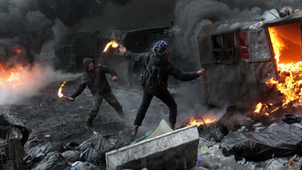 Protesters clash with police in central Kiev.