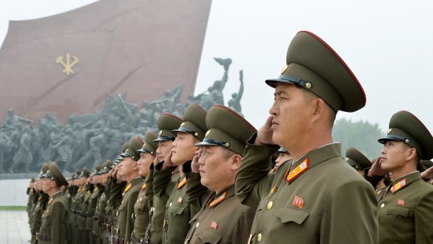 North Korean soldiers salute at Munsu Hill in Pyongyang, North Korea to mark the 69th anniversary of the country's founding on Saturday.