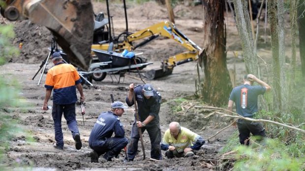 Police search an area at Flat Rock Creek in East Gippsland yesterday where, after receiving 'credible evidence', they believe the body of Prue Bird may be buried.