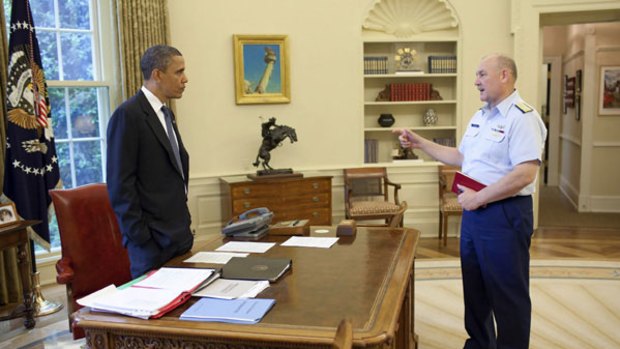 US President Barack Obama is briefed on the response to the BP oil spill by National Incident Commander Admiral Thad Allen in the Oval Office.
