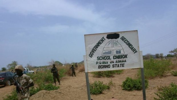 Soldiers stand guard in front of  Government Girls Secondary School in Chibok.