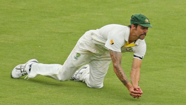 Mitch Johnson sprawls forward to claim a difficult catch off England's Ian Bell just before tea.