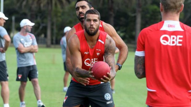 Settling in: Buddy Franklin with Adam Goodes at training. Jarrad McVeigh says Franklin's experience with Hawthorn is proving valuable.