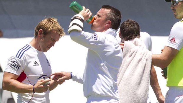 Graeme Swann is treated for an injured hand.