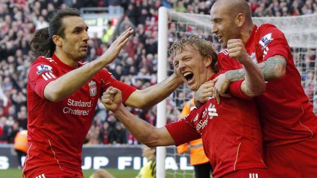 Sotirios Kyrgiakos (left) with Dirk Kuyt and Raul Meireles playing for Premier League side Liverpool.