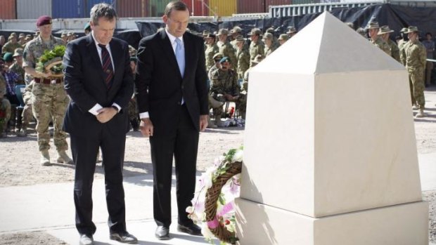 Opposition Leader Bill Shorten and Prime Minister Tony Abbott lay wreaths during a recognition ceremony in Tarin Kowt, Oruzgan Province, Afghanistan to honour the 40 Australian lives lost during the conflict.