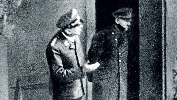 Hitler inspects bombing damage in one of the final photographs taken before his suicide in 1945.