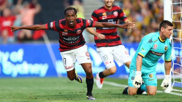 You beauty: Youssouf Hersi celebrates after putting the Wanderers 2-0 up on Monday night.