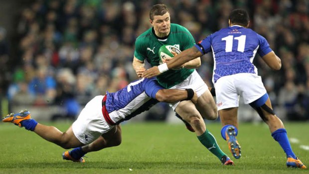 Swan song: Ireland centre Brian O'Driscoll mixes it with Samoa last weekend.