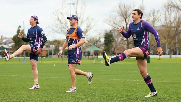 Kicking into gear ... Storm and Kangaroos No.1 Billy Slater and his Melbourne teammates are put through their paces at training as they prepare for Friday's clash with Manly.