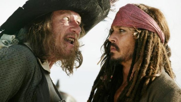 Geoffrey Rush as Captain Barbossa  Geoffrey Rush with Johnny Depp as Captain Jack Sparrow  Johnny Depp, in <i>Pirates of the Caribbean: At World's End</i>.
