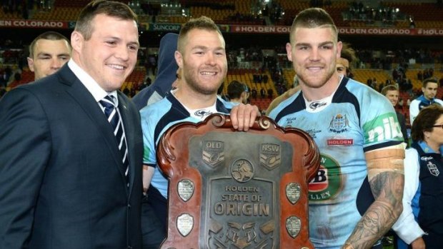 Ouch: Trent Merrin (centre), with Dragons and NSW teammates Brett Morris and Josh Dugan, injured the AC joint in his shoulder during game three against Queensland.