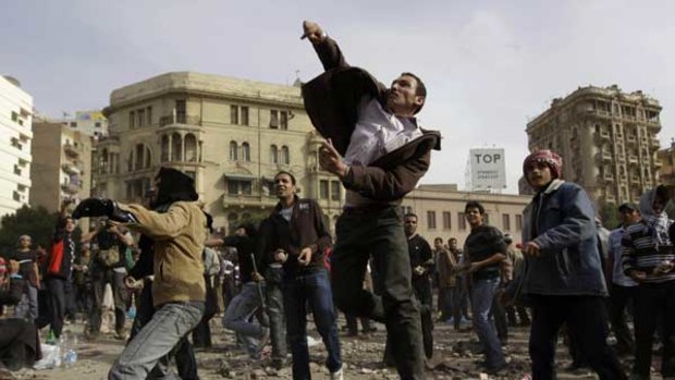 Protesters thrown stones during clashes in Cairo.