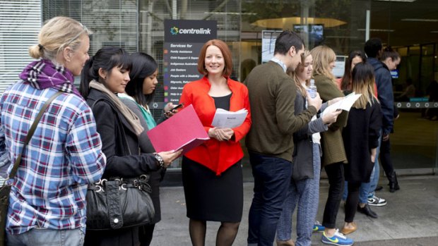 People queue outside an open door with a wax figurine of Julia Gillard