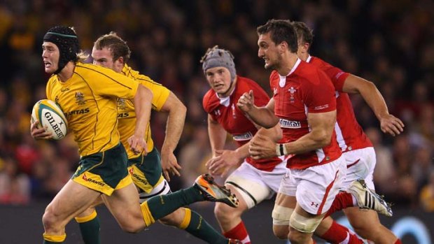 Catch me if you can ... Berrick Barnes puts in a top performance for the Wallabies.