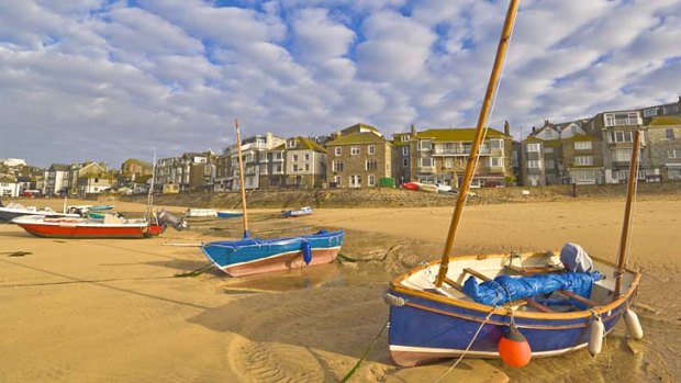 Sands of ages: Boats await the tide at St Ives.
