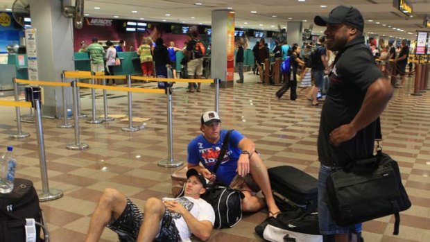 Grounded ... former NRL players Adam MacDougall and Rhys Wesser flank current Manly Sea Eagles player Matt Cross.