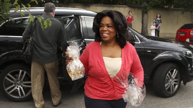 Oprah Winfrey arrives at the Toorak home of Megan Castran on Friday night.