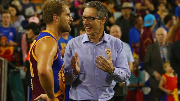 Brisbane Lions chairman Angus Johnson (right) congratulates Joel Patfull after the win over the Western Bulldogs.