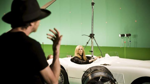 Star vehicle &#8230; actor Evan Rachel Wood takes the wheel on the set of the Gucci Guilty Intense campaign shoot.