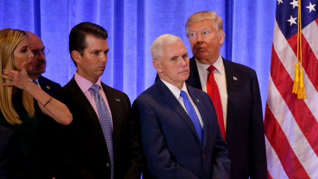 President-elect Donald Trump listens with Vice President-elect Mike Pence, daughter Ivanka Trump and Donald Trump Jr. as one of his attorneys speaks during a news conference.