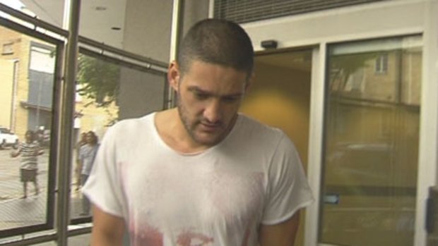 Brendan Fevola leaves Brisbane's Roma Street police watchhouse after being arrested in the early hours of New Year’s Day.