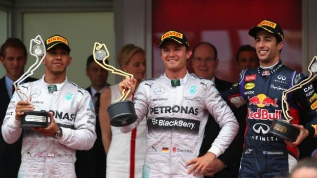 The podium: Rosberg (c) with Lewis Hamilton (L) of Great Britain and Daniel Ricciardio of Australia.