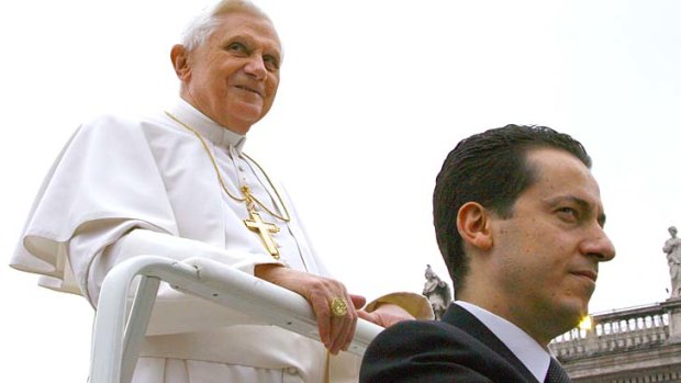 A file image of Pope Benedict XVI and his butler Paolo Gabriele at a weekly general audience at St Peter's square.
