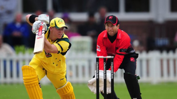 Australia's David Warner in action during his side's tour opener against Leicestershire, as Foxes wicketkeeper Paul Dixey looks on.